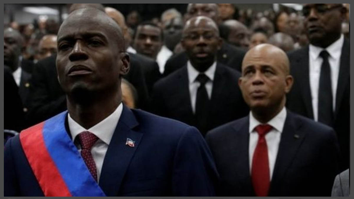 Jovenel-Moise-at-his-inauguration-flanked-by-Michel-Martelly.jpg