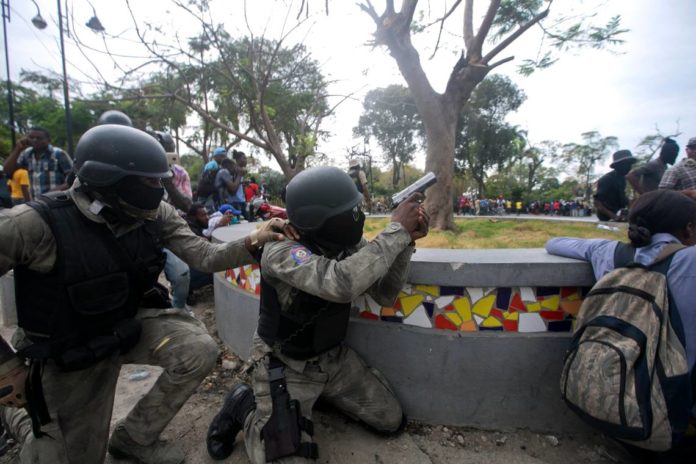 2020-02-23-Haitian-police-firing-at-Haitian-soldiers-696x464.jpg