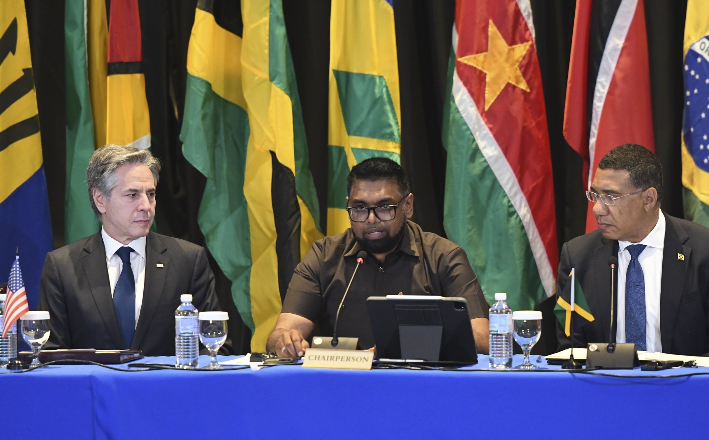 US Secretary of State Anthony Blinken oversees the proceedings conducted by CARICOM allies Guyanese President Irfaan Ali and Jamaican Prime Minister Andrew Holness in Kingston, Jamaica on March 11, 2024. Photo: AP/Collin Reid.