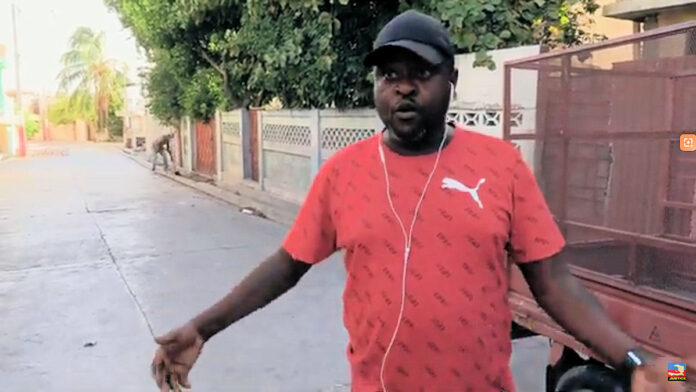 Jimmy Barbecue Cherizier speaking to reporters in a clean and quiet Delmas 6 in August 2021