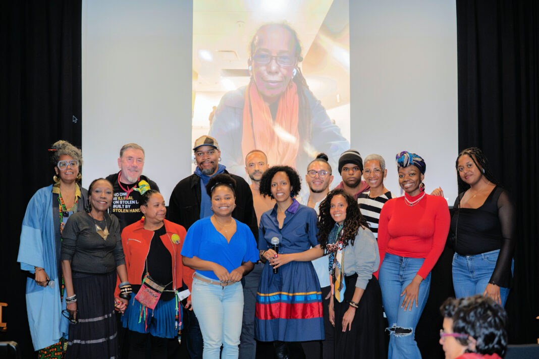 2025 10 12 Clairvel Ruiz, Dominicans Love Haitians founder, with Rachele Magloire on screen after screening 1964 Simitye Kamoken photo Joel Mentor