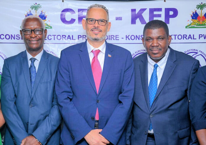Jean Gracien, Minister Delegate in charge of electoral matters, Alix Didier Fils Aime, and CEP president Jacques Desrosier