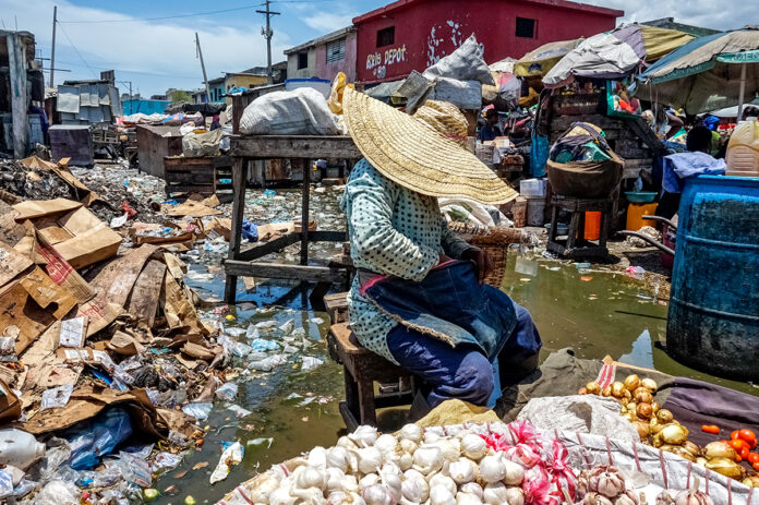 CROIX-DES-BOSSALES in 2019 Mariette Paul sells tomatoes and onions amid sewage Photo Marie Michelle Felicien GPJ Haiti